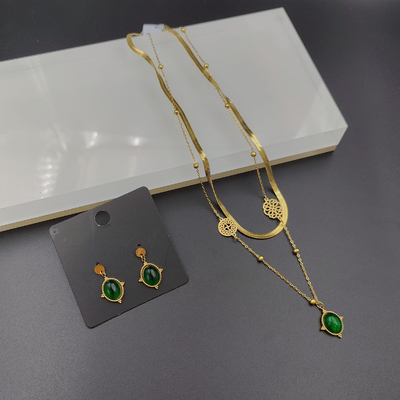 Nieuwste gouden kleur roestvrij staal oorbel, halsketting, armband met groene steen voor dame